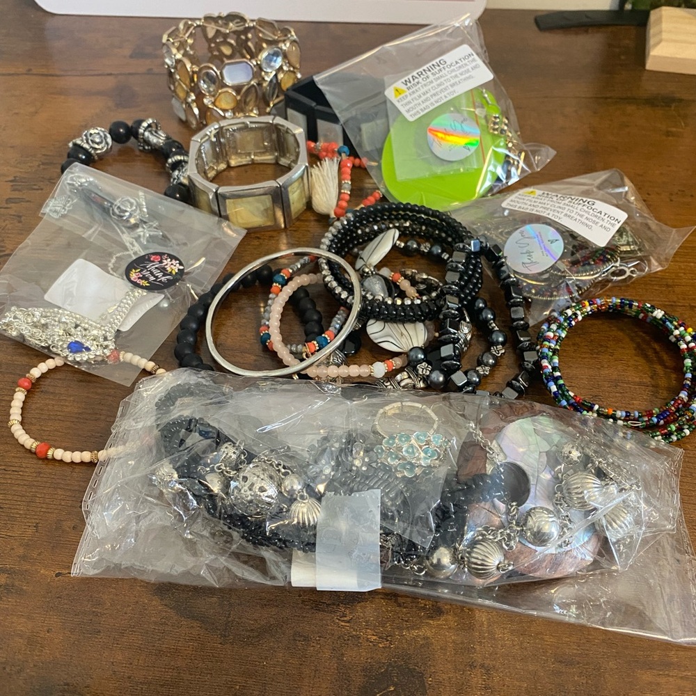 Mixed lot of costume jewelry. Earrings bracelets necklaces. Some flawed …